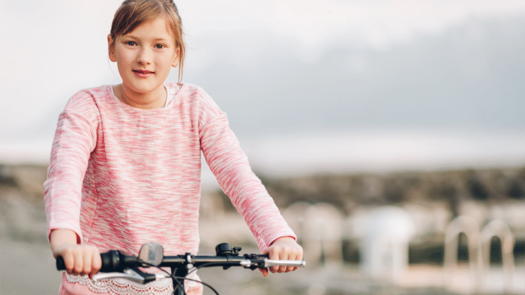 family cycling beside Loch Katrine