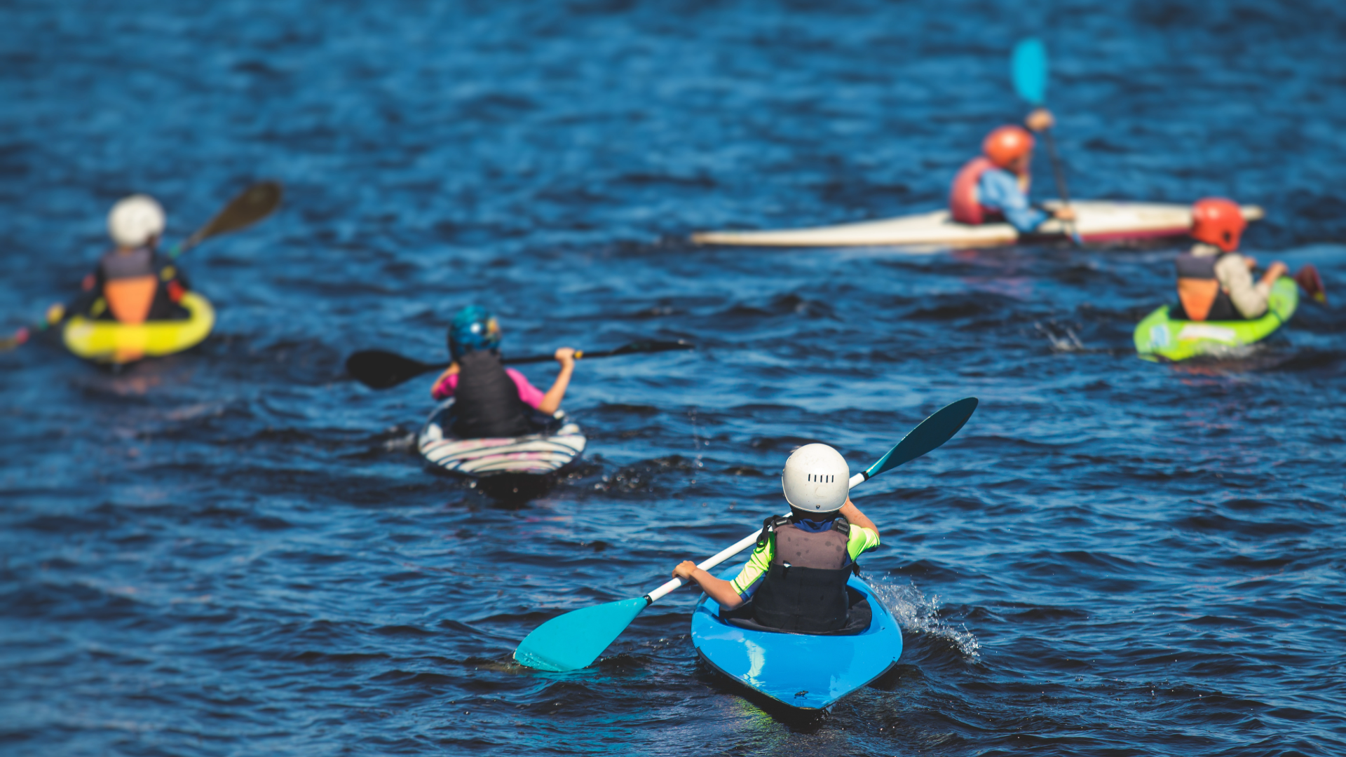 Children kayaking or paddling on Loch Ard