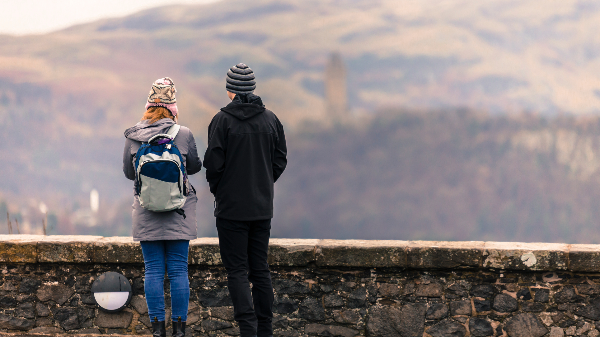 A family at Stirling Castle or looking out from its walls