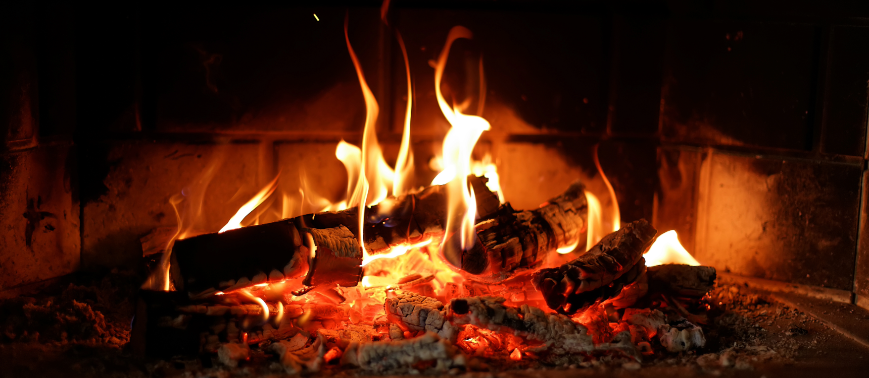 “Log-burning stove in a cozy Scottish cottage in the Trossachs.”