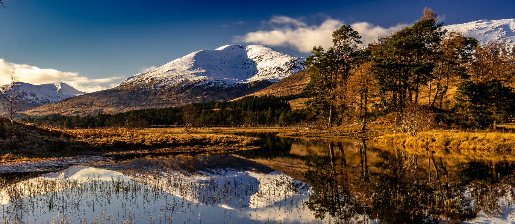 Misty winter reflections across a Trossachs loch photography opportunity