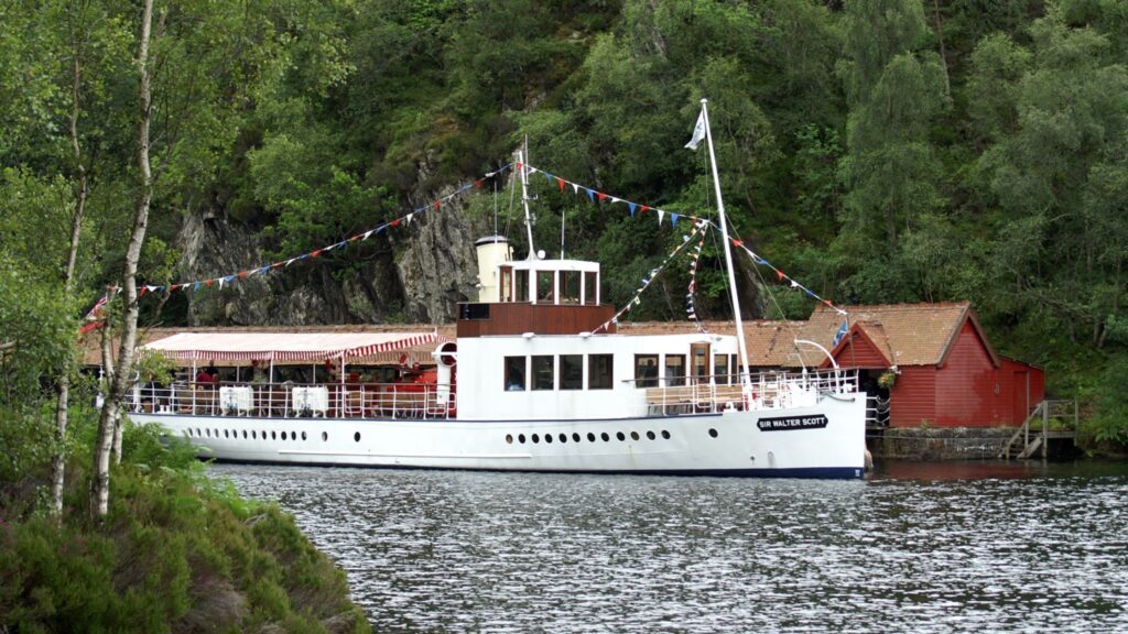 Steamship Sir Walter Scott cruising on Loch Katrine in the Trossachs National Park